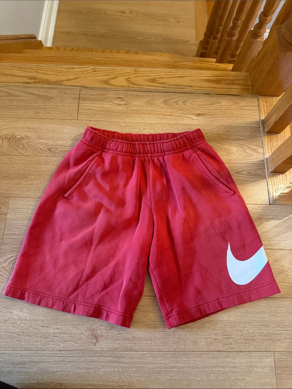 Nike men’s Red Athletic Shorts with White Swoosh- small